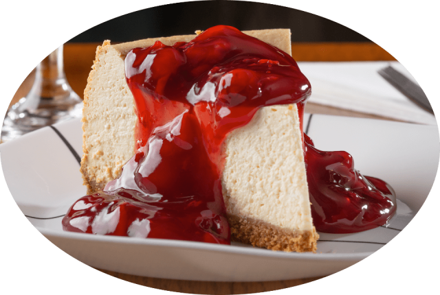 Piece of Cheese Cake with Cherry topping.